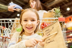 Happy-little-girl-holding-shopping-569592