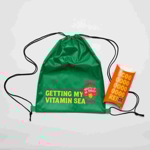 Four Square Lucky Dip green drawstring bag