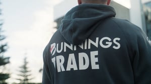 A man wearing a Novelli Bunnings Trade hoodie