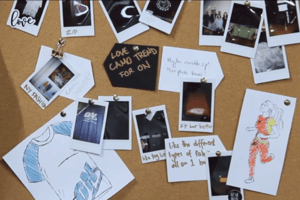 A corkboard with polaroids of Novelli concept designs pinned to it