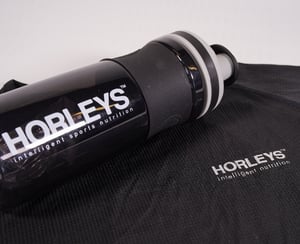 Horleys (NZ) practical sports drink bottle on a dry-fit sports t-shirt